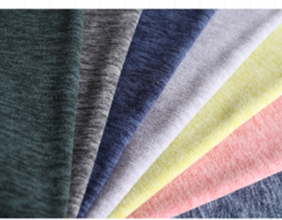 Fan of heather-melange jersey swatches in grey, navy and pastel tones.